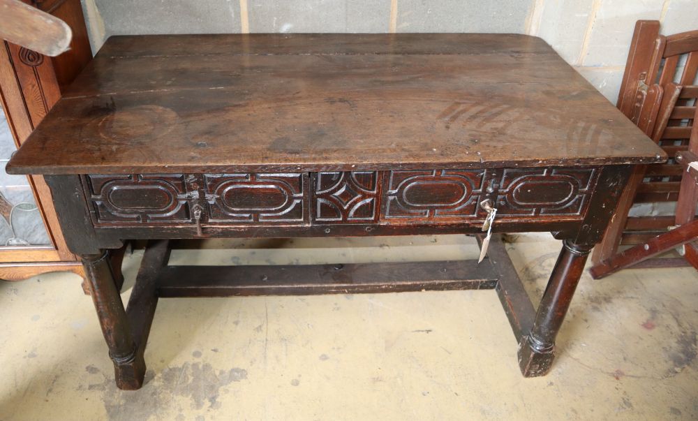 An 18th century style oak two drawer side table, W.134cm, D.73cm, H.77cm